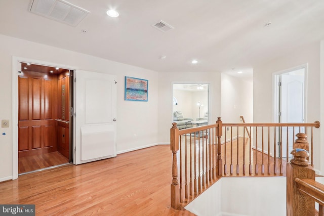 15303 Glastonbury Way, Upper Marlboro, MD 20774 - hallway featuring an upstairs landing, light wood-style floors, recessed lighting, and baseboards