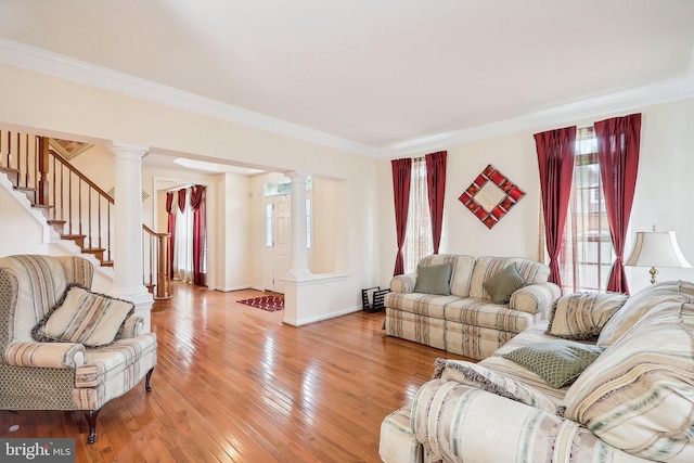 15303 Glastonbury Way, Upper Marlboro, MD 20774 - living room featuring decorative columns, ornamental molding, light wood-type flooring, stairway, and baseboards