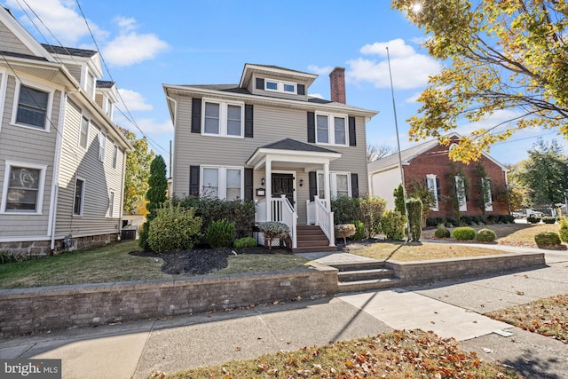 view of front of house featuring covered porch and central AC unit