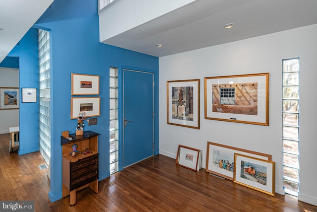 foyer entrance with dark hardwood / wood-style floors