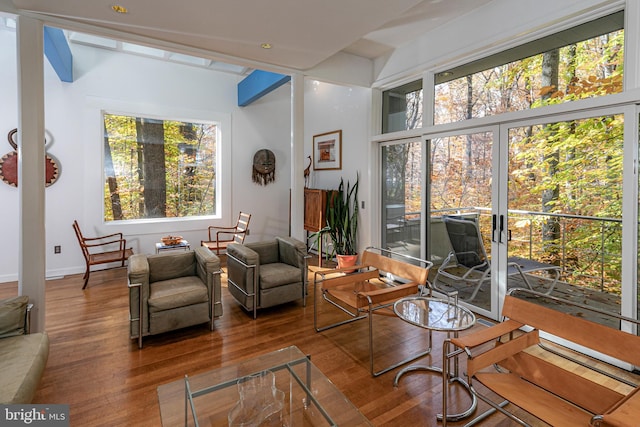 sitting room with wood-type flooring