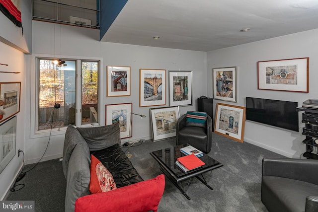 living room featuring dark carpet