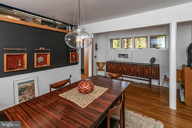 dining space featuring wood-type flooring