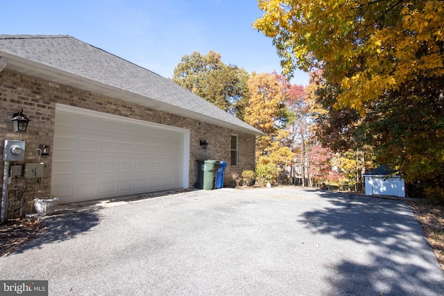 view of property exterior featuring a garage