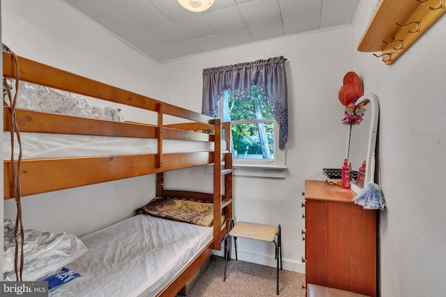 carpeted bedroom with baseboards