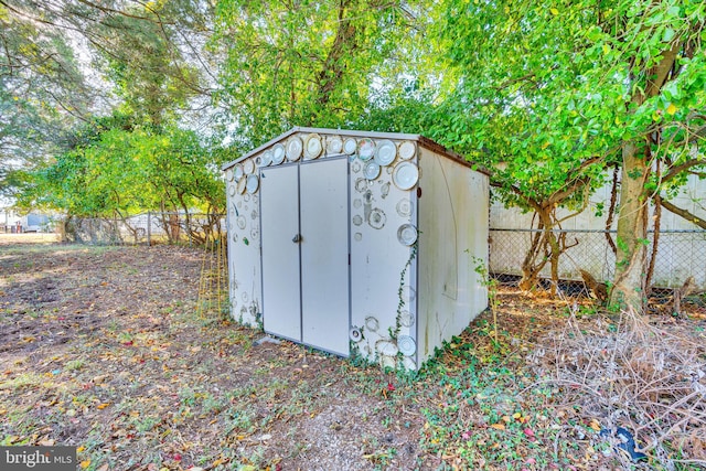 view of shed with a fenced backyard