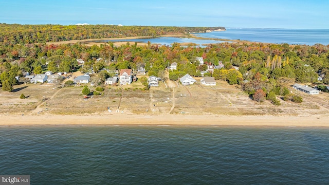 aerial view featuring a water view and a beach view