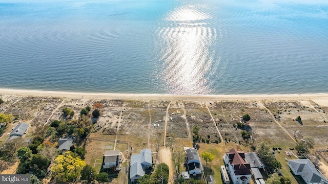 aerial view featuring a beach view and a water view
