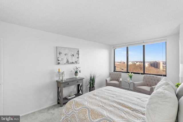 carpeted bedroom featuring a textured ceiling