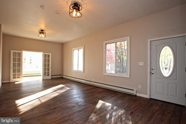 foyer featuring dark wood-type flooring and a baseboard radiator