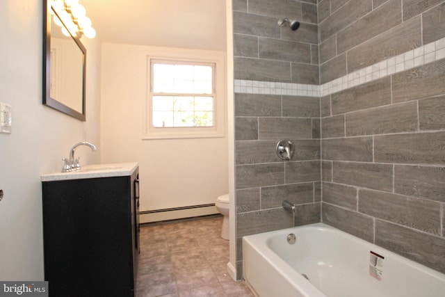 full bathroom featuring baseboard heating, vanity, tiled shower / bath, and toilet