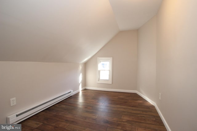 bonus room featuring vaulted ceiling, a baseboard heating unit, and dark hardwood / wood-style floors