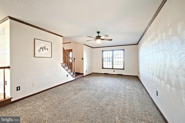 unfurnished room with ornamental molding, carpet floors, and ceiling fan