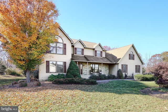 front facade with a front yard