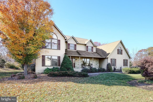41 Howard Dr, East Berlin, PA 17316 - traditional-style home with a front yard, a shingled roof, and covered porch