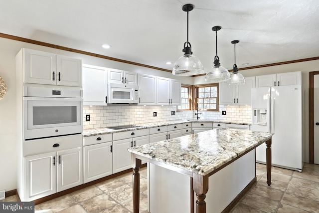 kitchen with a kitchen island, a breakfast bar area, hanging light fixtures, white cabinets, and white appliances