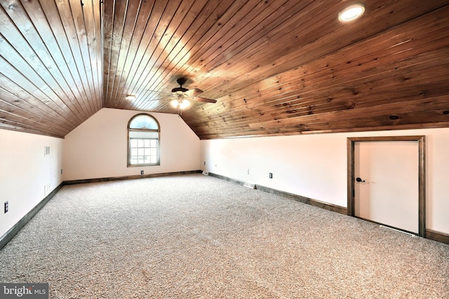 additional living space featuring lofted ceiling, wood ceiling, and carpet floors