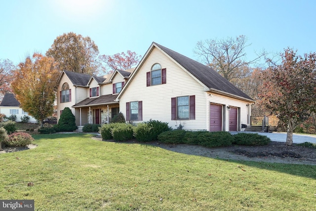 front facade with a garage and a front lawn