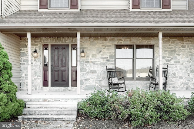 doorway to property featuring covered porch