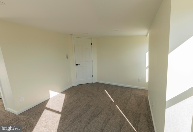 unfurnished room featuring carpet flooring