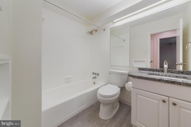 full bathroom featuring vanity, shower / washtub combination, wood-type flooring, and toilet