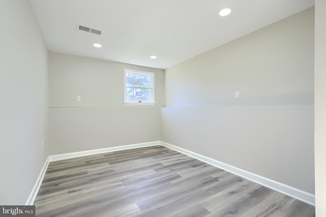 spare room featuring light wood-type flooring