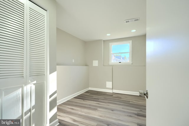 laundry room featuring hardwood / wood-style flooring