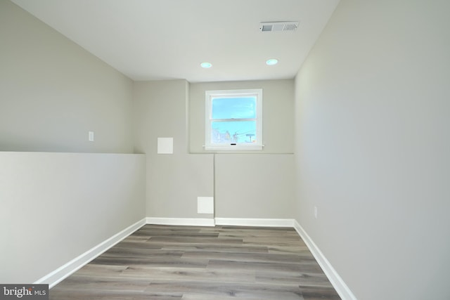 unfurnished room with hardwood / wood-style floors