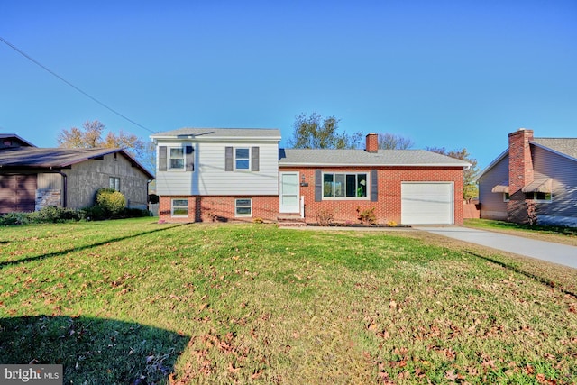 split level home with a garage and a front lawn