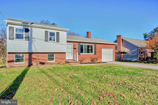 tri-level home with a front yard and a garage