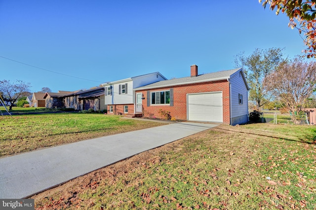 split level home with a garage and a front yard