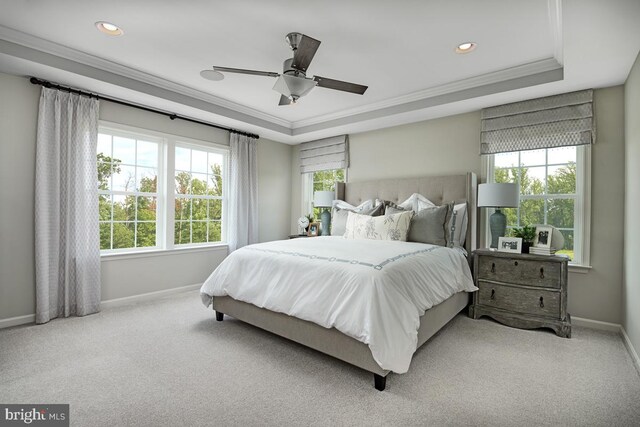 bedroom featuring multiple windows, light colored carpet, and ceiling fan