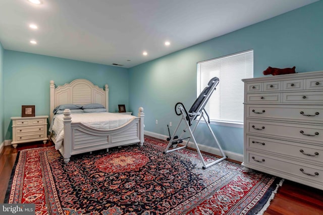 bedroom with dark wood-type flooring