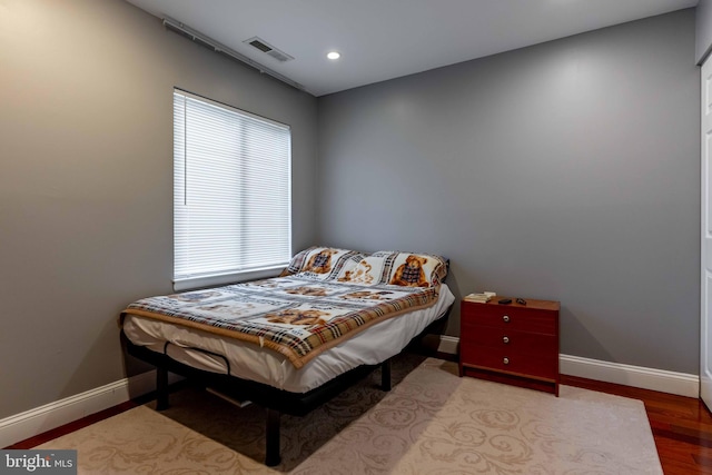 bedroom with light wood-type flooring