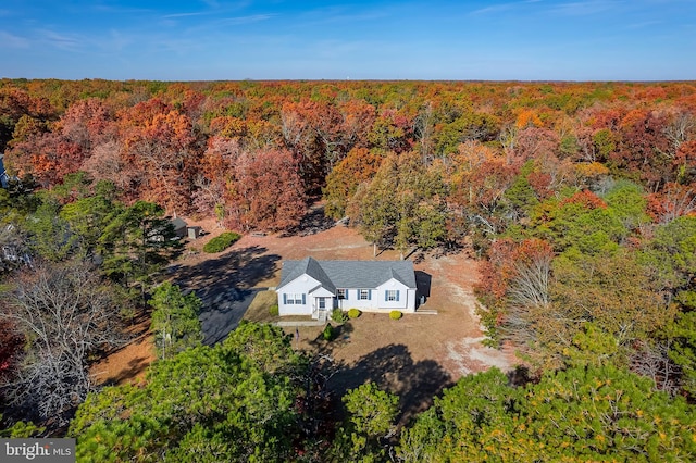 aerial view featuring a wooded view