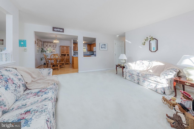 living area with carpet flooring and baseboards