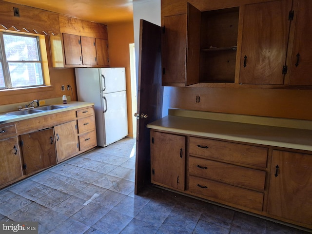 kitchen featuring sink and white refrigerator