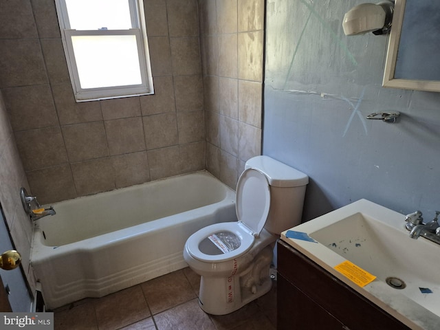 full bathroom with vanity, toilet, tiled shower / bath combo, and tile patterned flooring