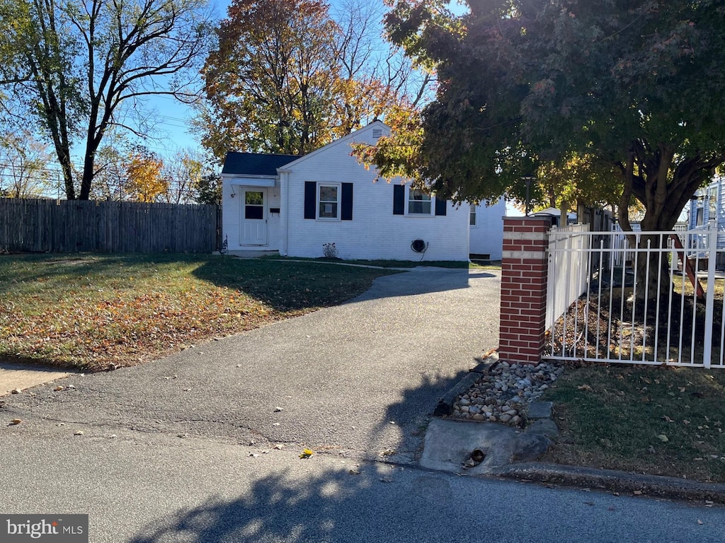 view of property exterior featuring a lawn