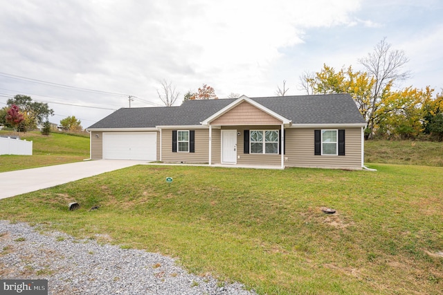 ranch-style home featuring a front lawn and a garage