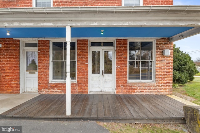 entrance to property with french doors and a deck