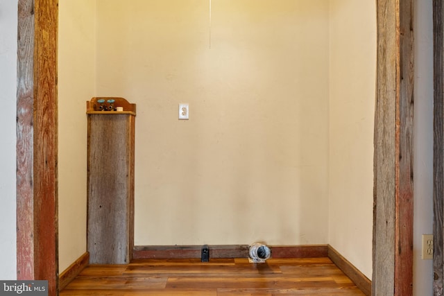 laundry area with light wood-type flooring