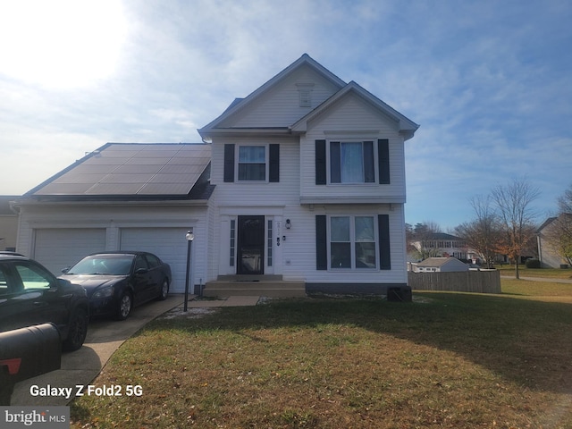 view of front facade featuring a front lawn, a garage, and solar panels