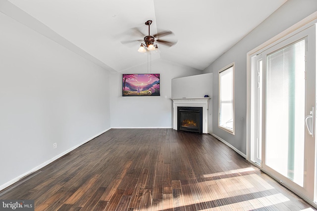 unfurnished living room featuring ceiling fan, dark wood-type flooring, and lofted ceiling