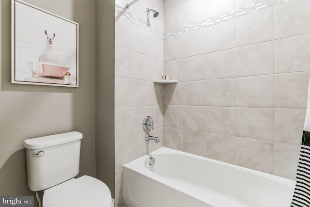 bathroom with toilet and shower / tub combo with curtain