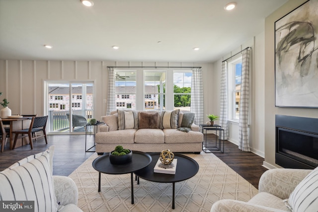 living room with dark hardwood / wood-style flooring