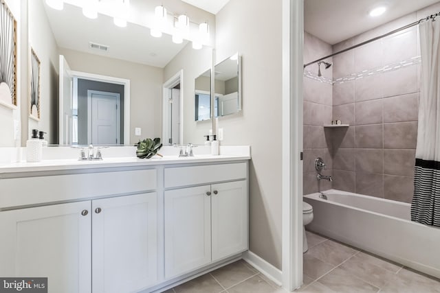 full bathroom with toilet, shower / tub combo with curtain, vanity, and tile patterned flooring