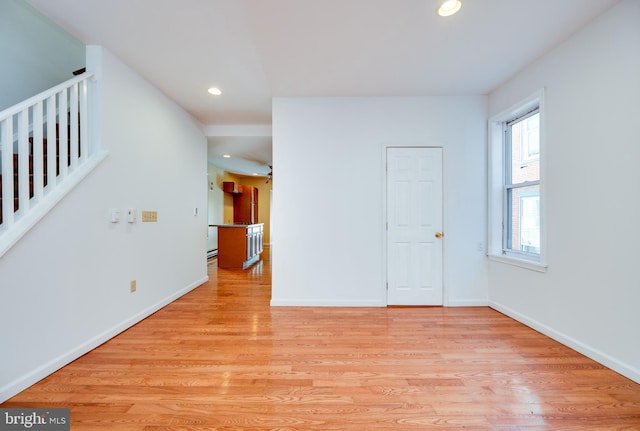 unfurnished room featuring light wood-type flooring