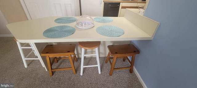 dining space with carpet