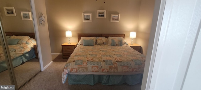 carpeted bedroom with a closet